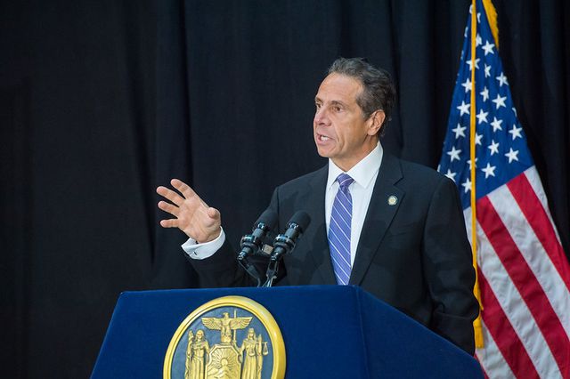 Governor Andrew Cuomo behind a podium making an announcement on December 16th.